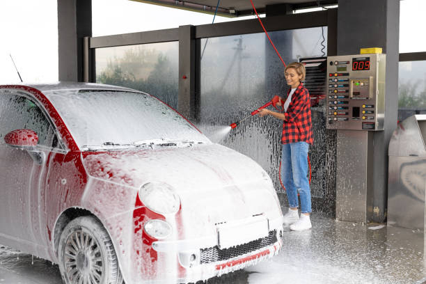 Mobile Car Wash Shrooms Q service in action, showing a professional team cleaning a vehicle.